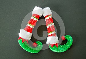 Red and green elf boots isolated on gray