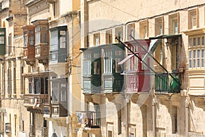 Red and green Valletta balconies photo