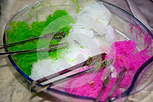 Red, green, white of Chilled sweet vermicelli in coconut milk in Muslim wedding ceremony in Bangkok, Thailand