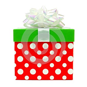 Red, green and white polka dot Christmas gift box isolated