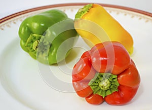 Red green and yellow peppers