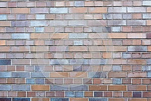 Red and grey grungy brick stone brick wall with dark gap