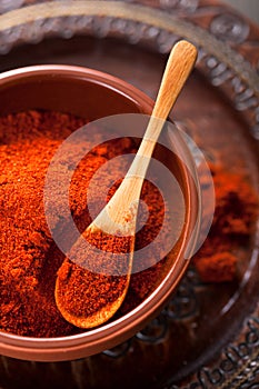 Red ground paprika spice in bowl