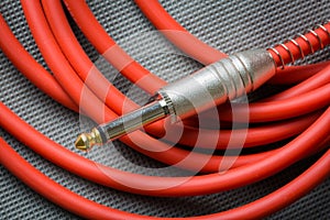 Red guitar cable jack