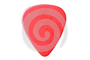 Red guitar pick up close isolated