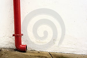 Red gutter in white wall