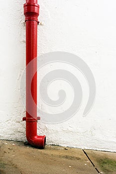 Red gutter in white wall