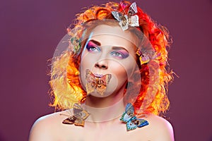 Red hair girl with butterflies