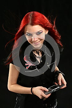 Red hair girl listening MP3 player