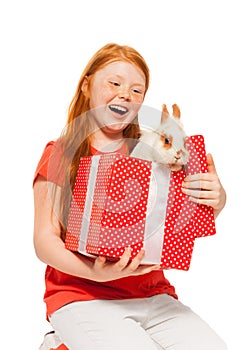 Red hair girls receive rabbit as present