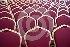 Red hair seats in empty conference room