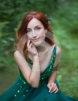 Red hair woman with green eyes and pretty smile is looking into your soul.