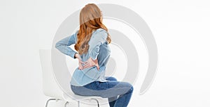 Red Hair Woman suffering from back pain. Incorrect sitting posture problems. Pain relief , chiropractic concept