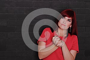 Red hair young woman looking serious, thoughtful girl, copy space