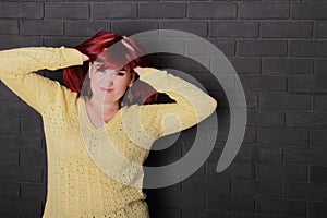 Red hair young woman looking serious, thoughtful girl, copy space