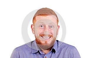 Red-haired, bearded man with an apologetic gesture. Funny portrait of ginger man with beard