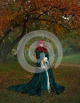 Red-haired beauty in search of the victim, the legend of Robin Hood, mysterious lady in green velvet long raincoat with