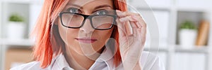 Red haired business woman with glasses