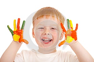 Red-haired child hands painted in bright colors photo