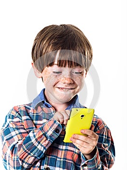 Red-haired funny boy with mobile phone