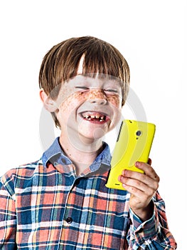 Red-haired funny boy with mobile phone