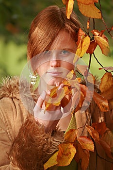 Red haired girl in autumn