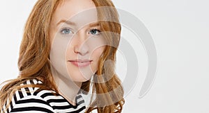 Red haired girl with close up macro face isolated on white background. Woman beauty and skin care. No make up concept. Redhead