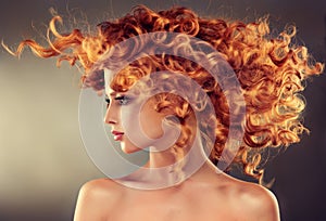 Red haired girl with curly hairstyle. photo
