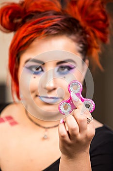 Red haired Girl With Fidget Spinner