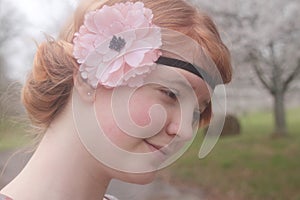 Red Haired Girl With a Flowered Headband