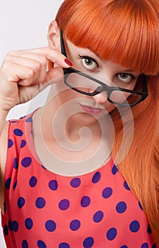 Red-haired girl in glasses