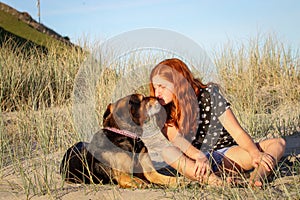 Red haired girl with pet dog