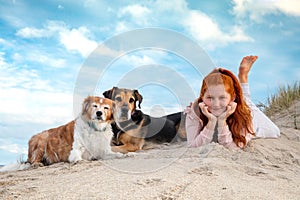 Red haired girl with two pet dog