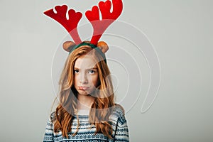 The red-haired girl was very offended by her parents on Christmas evening. The blue-eyed cutie is upset by the New Year