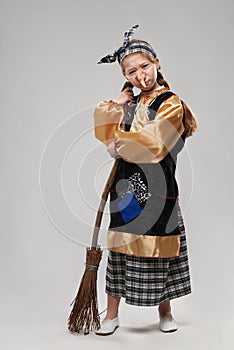 Red-haired girl in a witch costume