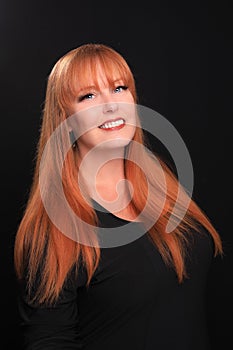 Red Haired Head Shot of Woman on Black Background