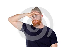Red haired man with long beard covering his nose