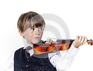 Red-haired preschooler boy with violin