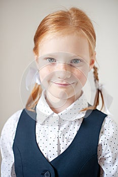 Red-haired schoolgirl indoors