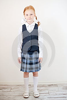 Red-haired schoolgirl indoors