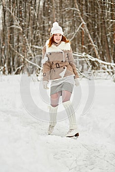 Red-haired teenage girl with braces on teeth