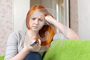 Red-haired teenager girl having disappointment