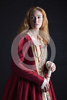 Red-haired Tudor woman in red dress