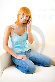 Red-haired woman with cellphone