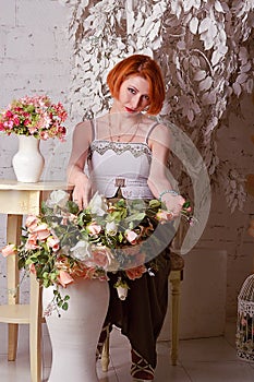 The red-haired woman with flowers