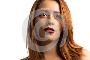 Red-haired woman looking away. Concept of aspirations, dreams and goals. Isolated on white background