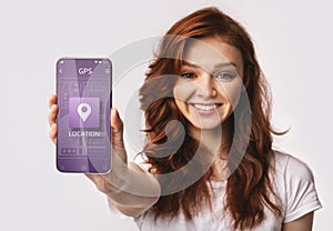 Red-Haired Woman Showing Smartphone With Mobile Navigation App, White Background