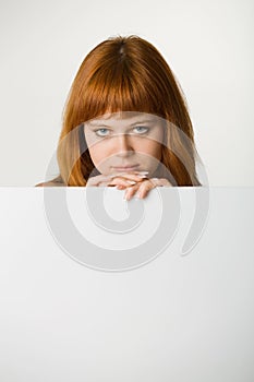 Red haired woman with sign