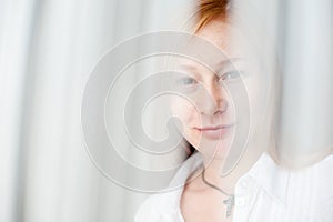 Red-haired woman smiling