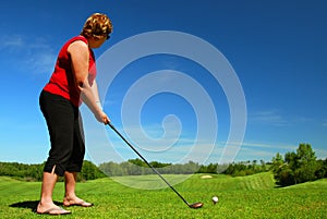 Red-Haired Woman Tees Off